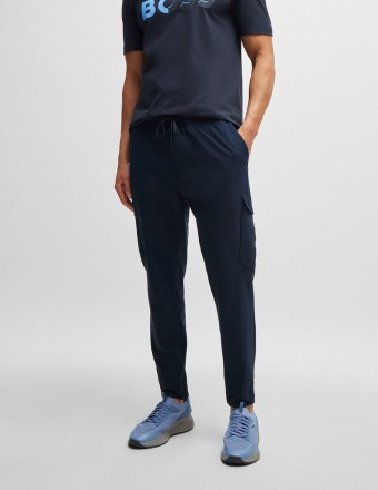 TAPERED-FIT TROUSERS IN...